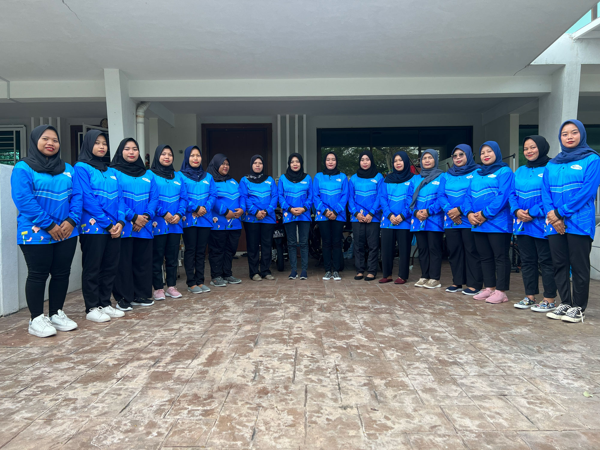 The MyKakaks cleaning team in matching blue branded uniforms